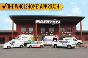 front-of-barron-building-with-service-vehicles-and-the-words-the-wholehome-approach