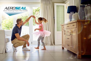man-playing-with-daughter-in-kitchen-with-aeroseal-logo